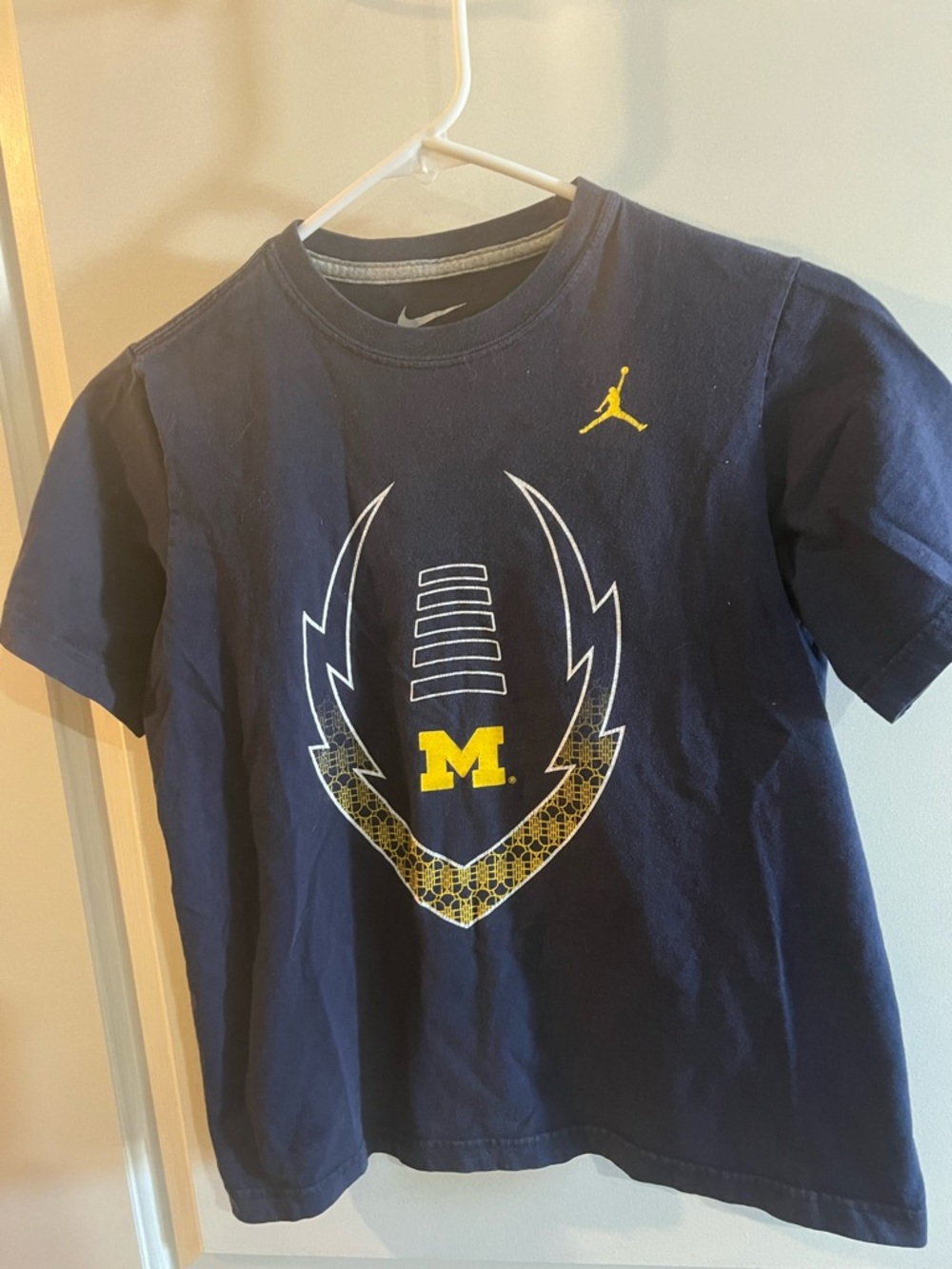 Nike Navy Blue Kids Football Graphic Tee with Yellow Accents